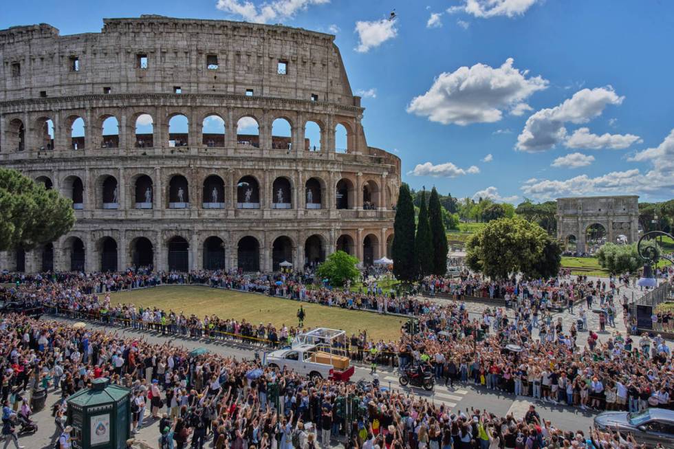 The coffin of Pope Francis passes the Colosseum in Rome, Saturday, April 26, 2025. (AP Photo/Be ...