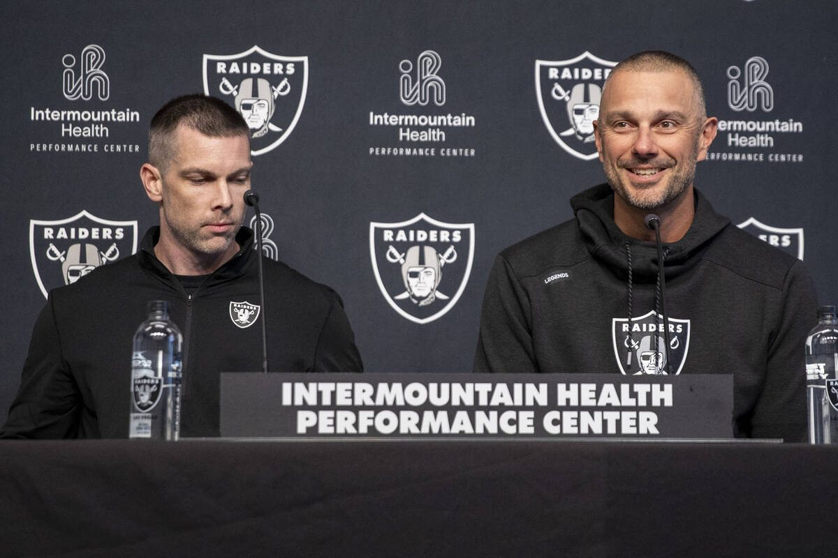 Raiders general manager John Spytek, right, and Director of College Scouting Brandon Yeargan ta ...