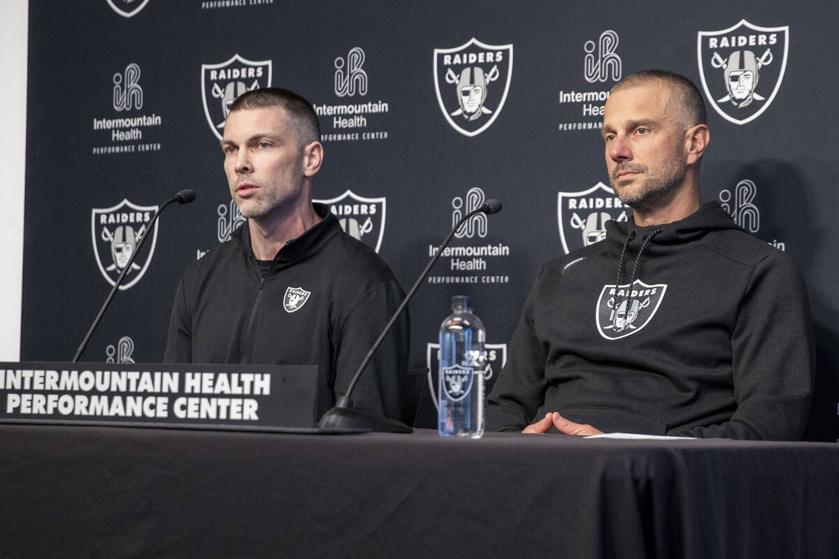 Raiders general manager John Spytek, right, and Director of College Scouting Brandon Yeargan ta ...