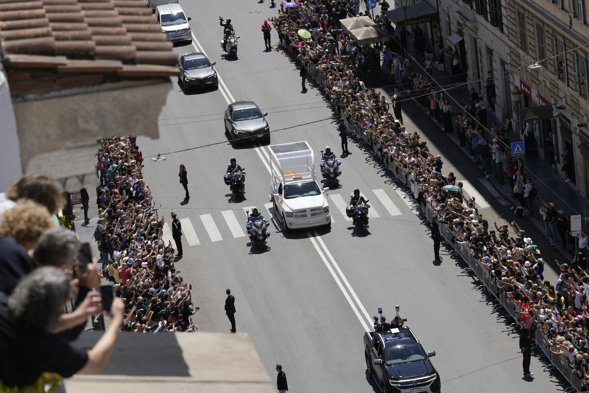 The coffin of Pope Francis makes its way to St. Mary Major Basilica in Rome, Saturday, April 26 ...