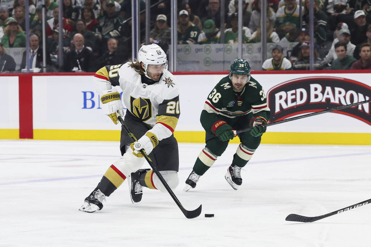 Vegas Golden Knights left wing Brandon Saad (20) controls the puck against Minnesota Wild right ...
