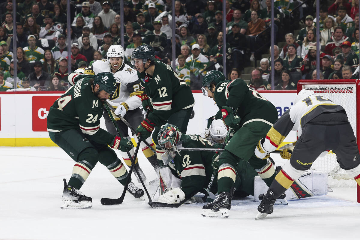 Minnesota Wild goaltender Filip Gustavsson (32) stops the puck against the Vegas Golden Knights ...