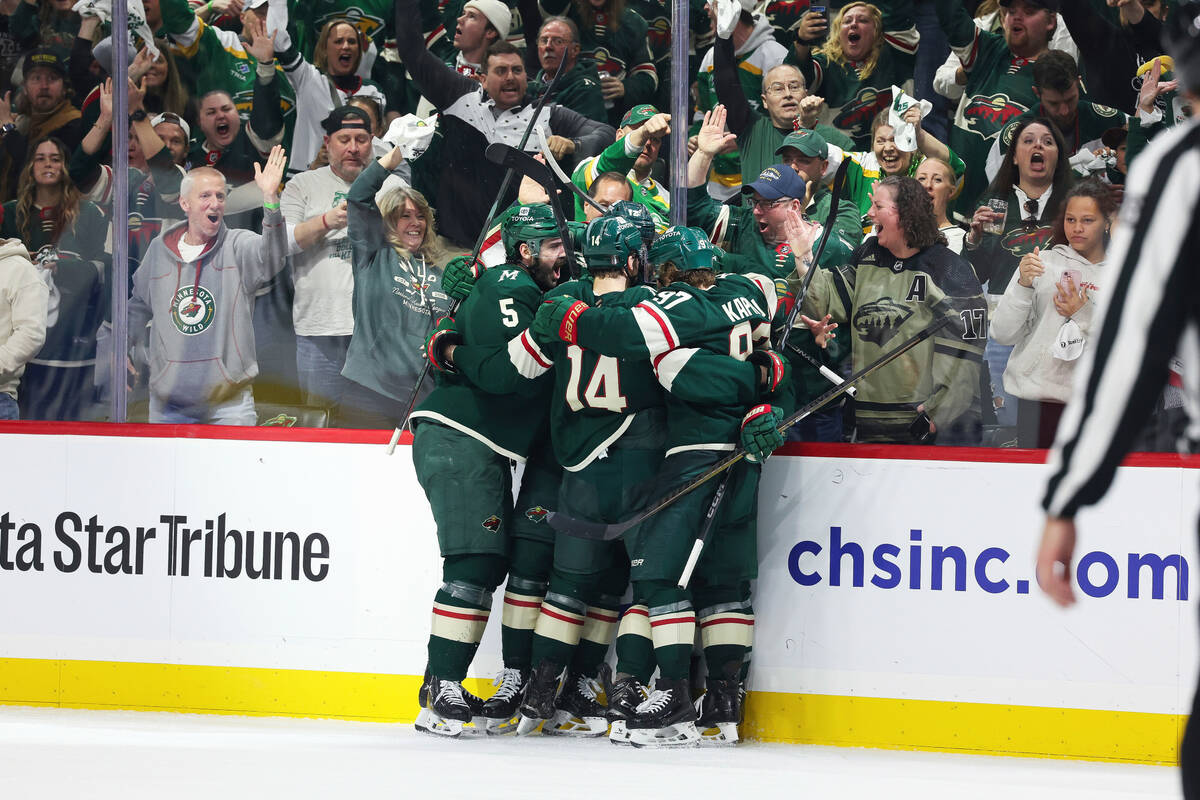 Minnesota Wild players celebrate after defenseman Jared Spurgeon scored a goal against the Vega ...