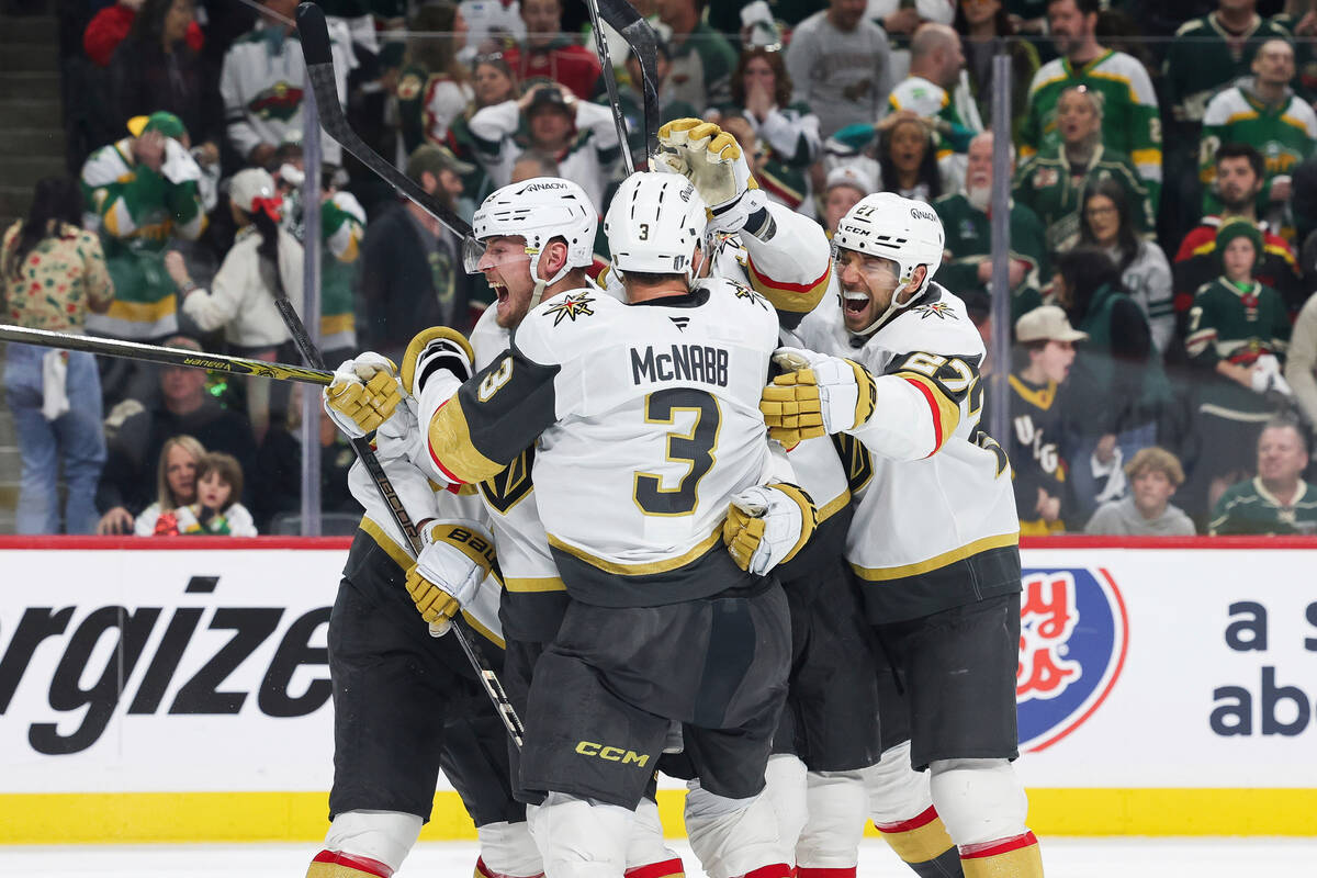 Vegas Golden Knights center Ivan Barbashev (49) celebrates with teammates after scoring a goal ...