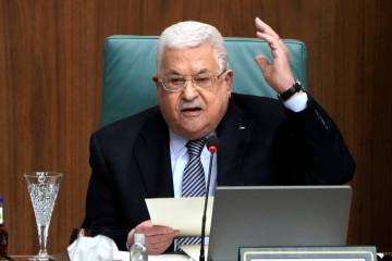 FILE - Palestinian President Mahmoud Abbas speaks during a conference at the Arab League headqu ...