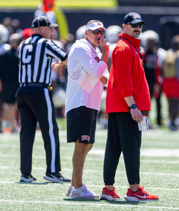 Head Coach Dan Mullen has a chat during UNLV spring football practice at the Fertitta Football ...