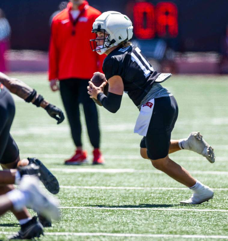 Quarterback Anthony Colandrea (10) looks to looks to pass up the field during UNLV spring footb ...