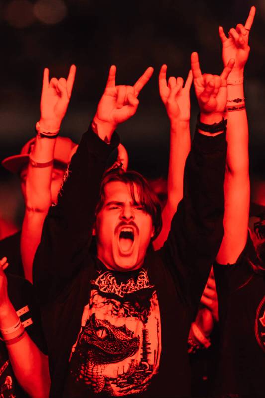 A fan cheers as AC/DC performs during their “Power Up” tour stop at Allegiant Sta ...