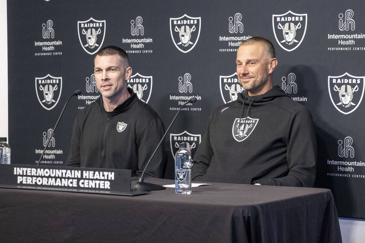 Raiders general manager John Spytek, right, and Director of College Scouting Brandon Yeargan an ...