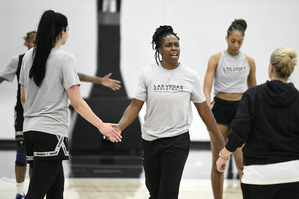 Chelsea Gray talks to teammates during the Las Vegas Aces first day of training camp Sunday, Ap ...