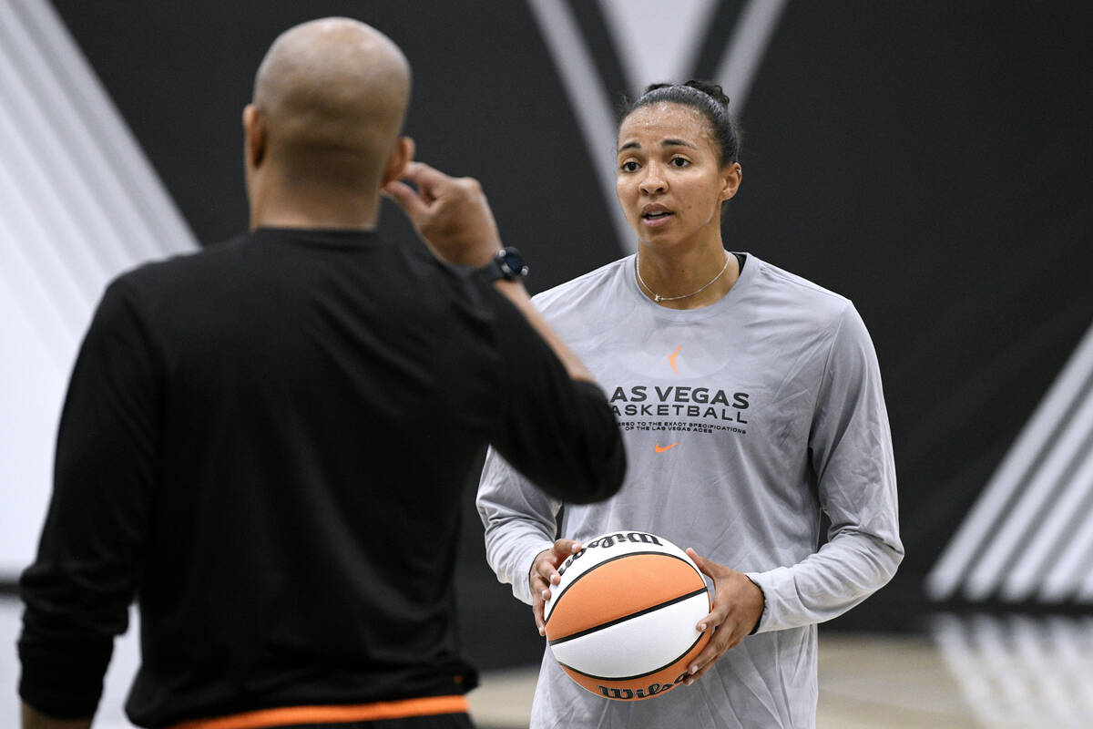 Kiah Stokes listens to a coach during the Las Vegas Aces first day of training camp Sunday, Apr ...