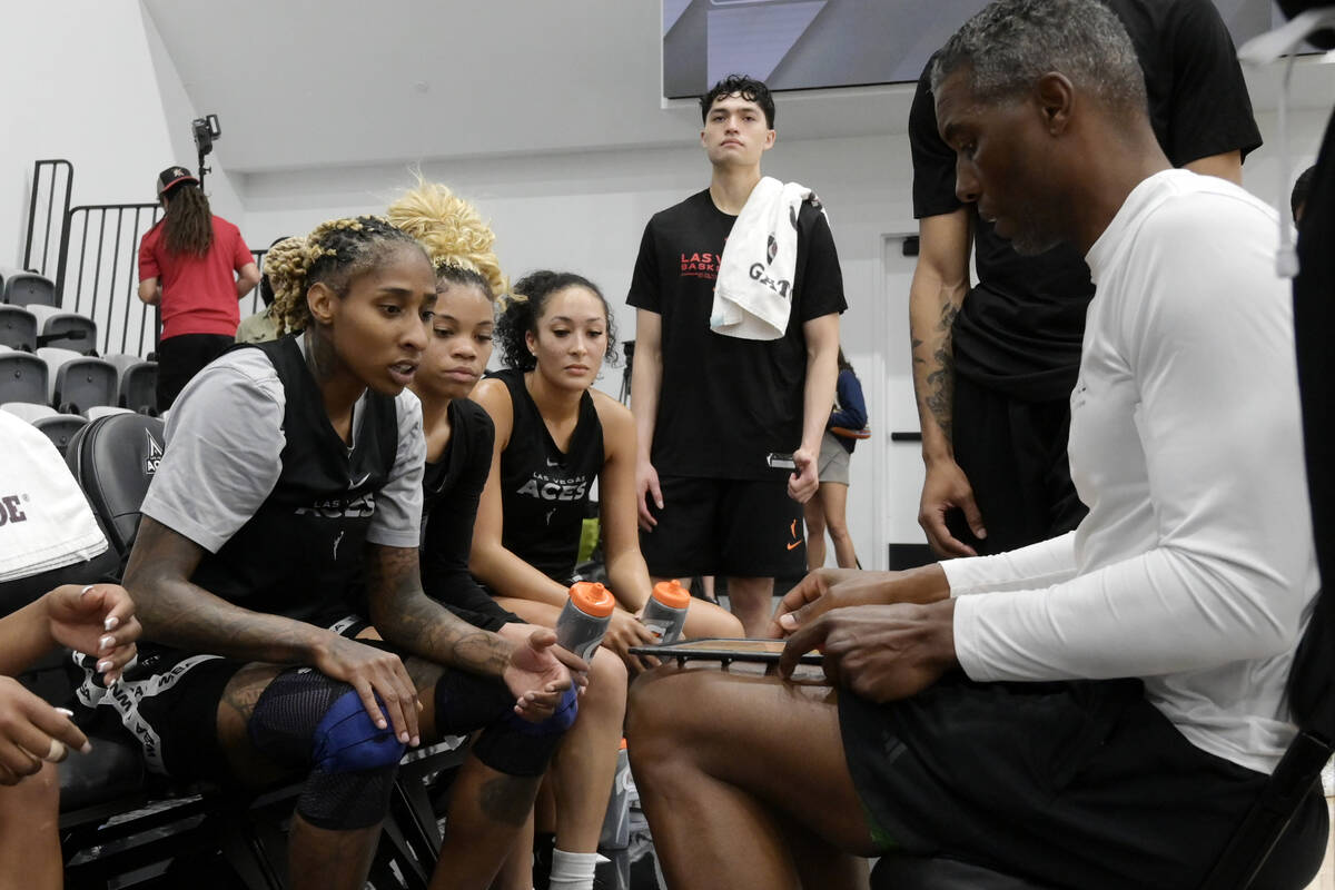 From left, Crystal Bradford, Harmoni Turner, and Aaliyah Nye listen to assistant coach Larry Le ...