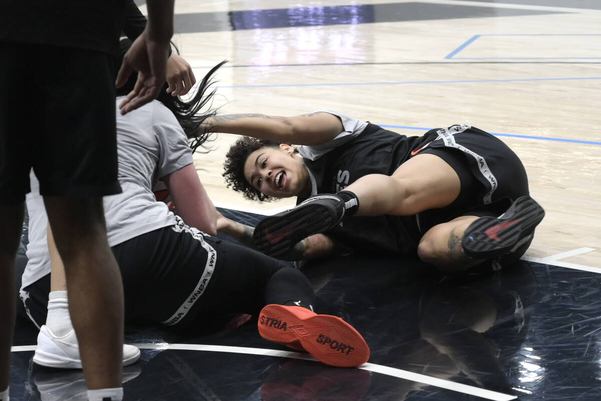 Kierstan Bell scrambles for a loose ball during the Las Vegas Aces first day of training camp S ...