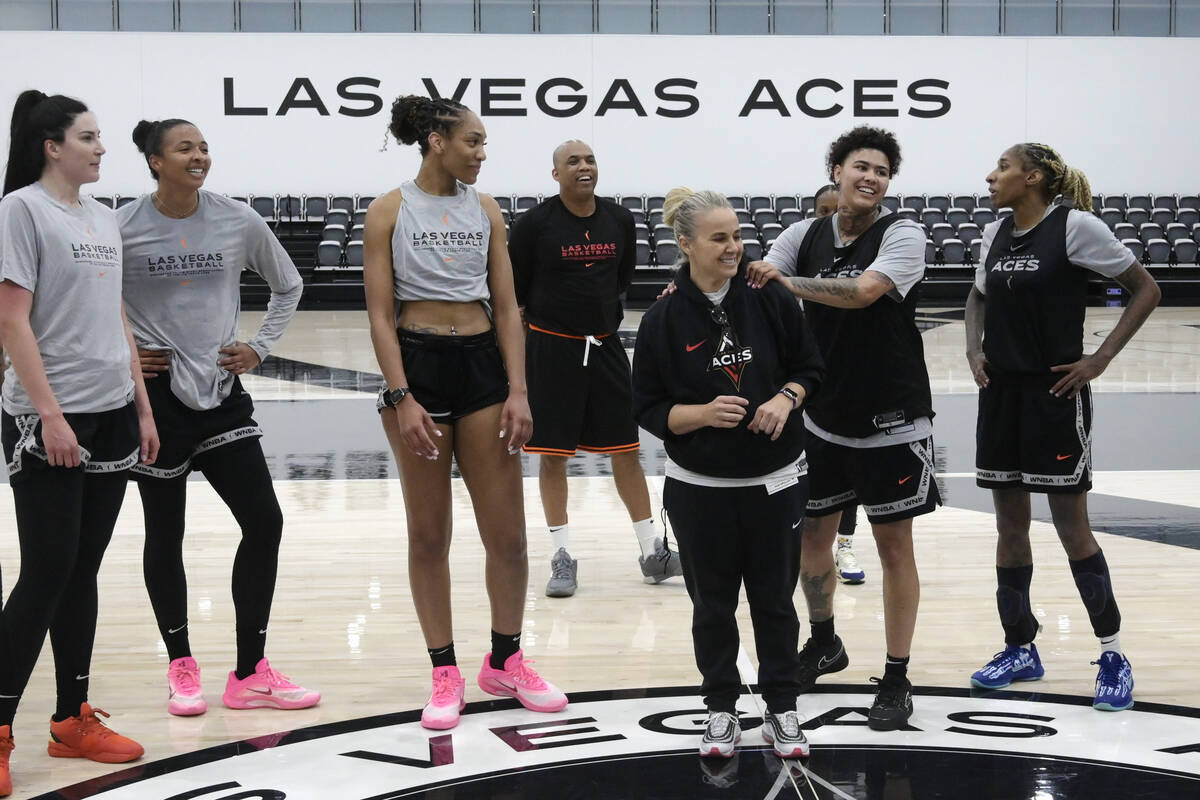 Kierstan Bell grabs head coach Becky Hammon’s shoulders a the end of the Las Vegas Aces first ...