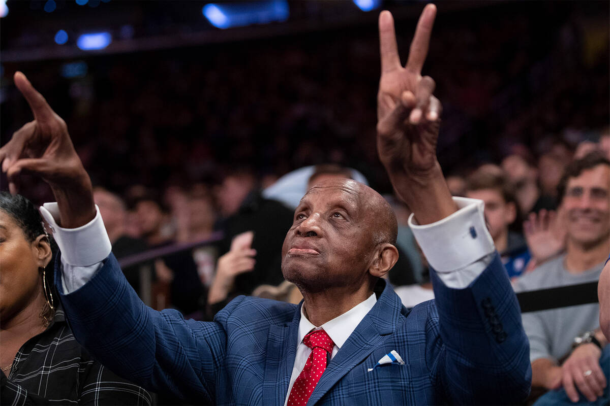 Hall of Fame inductee and former New York Knick Dick Barnett gestures during a timeout in the f ...
