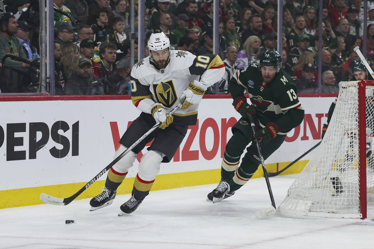 Vegas Golden Knights center Nicolas Roy (10) controls the puck against Minnesota Wild center Ya ...