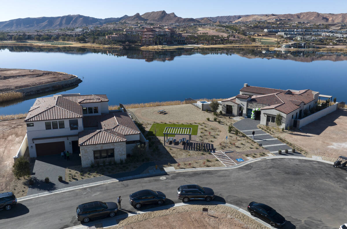 La Cova's two-story, left, and one-story model homes are seen at South Shore Lake Las Vegas, on ...