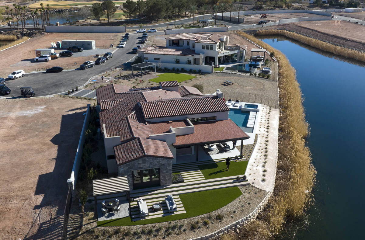 La Cova's one-story, front, and two-story model homes are seen at South Shore Lake Las Vegas, o ...