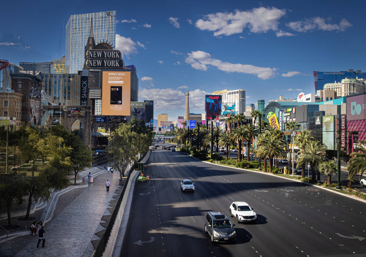 A nearly empty sidewalk is seen as traffic moves southbound along the Strip Tuesday, April 29, ...