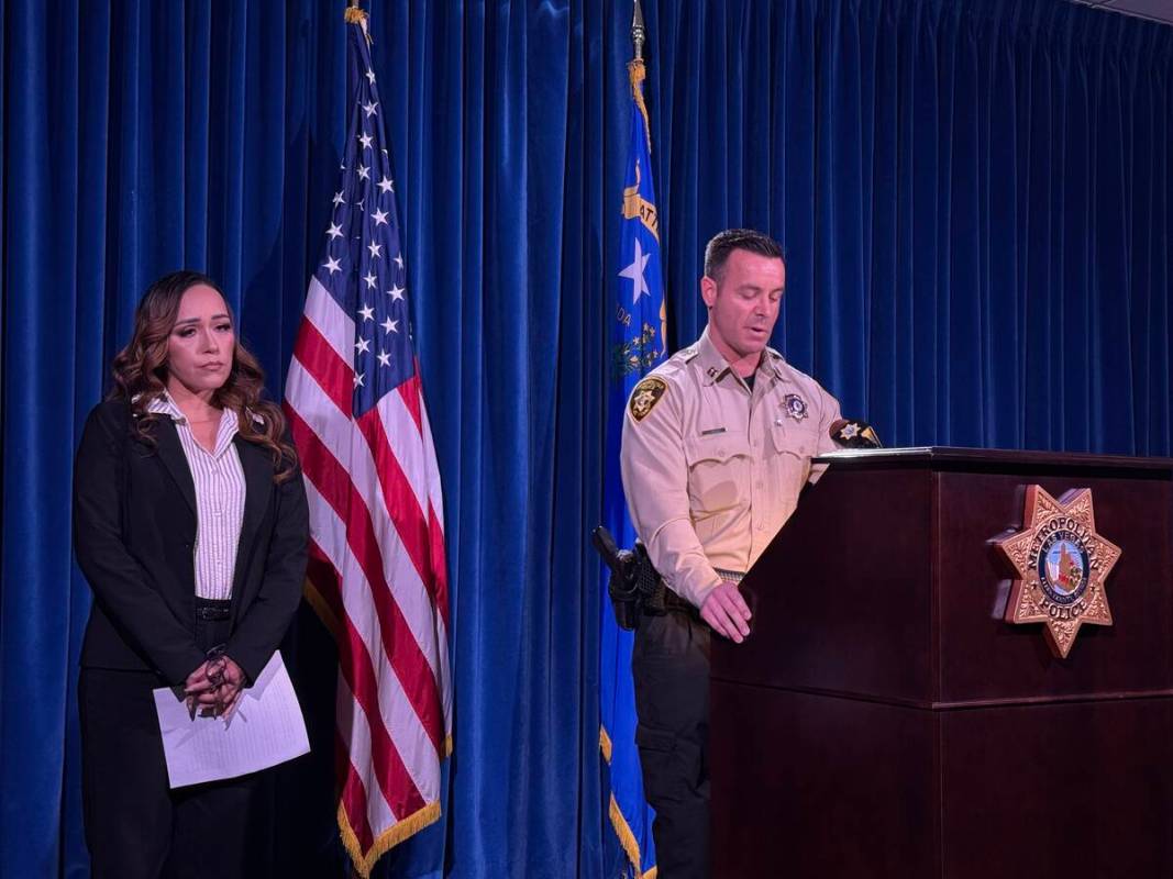 Metropolitan Police Department Capt. Jonathan Riddle, accompanied by Martha Carbajal, speaks to ...