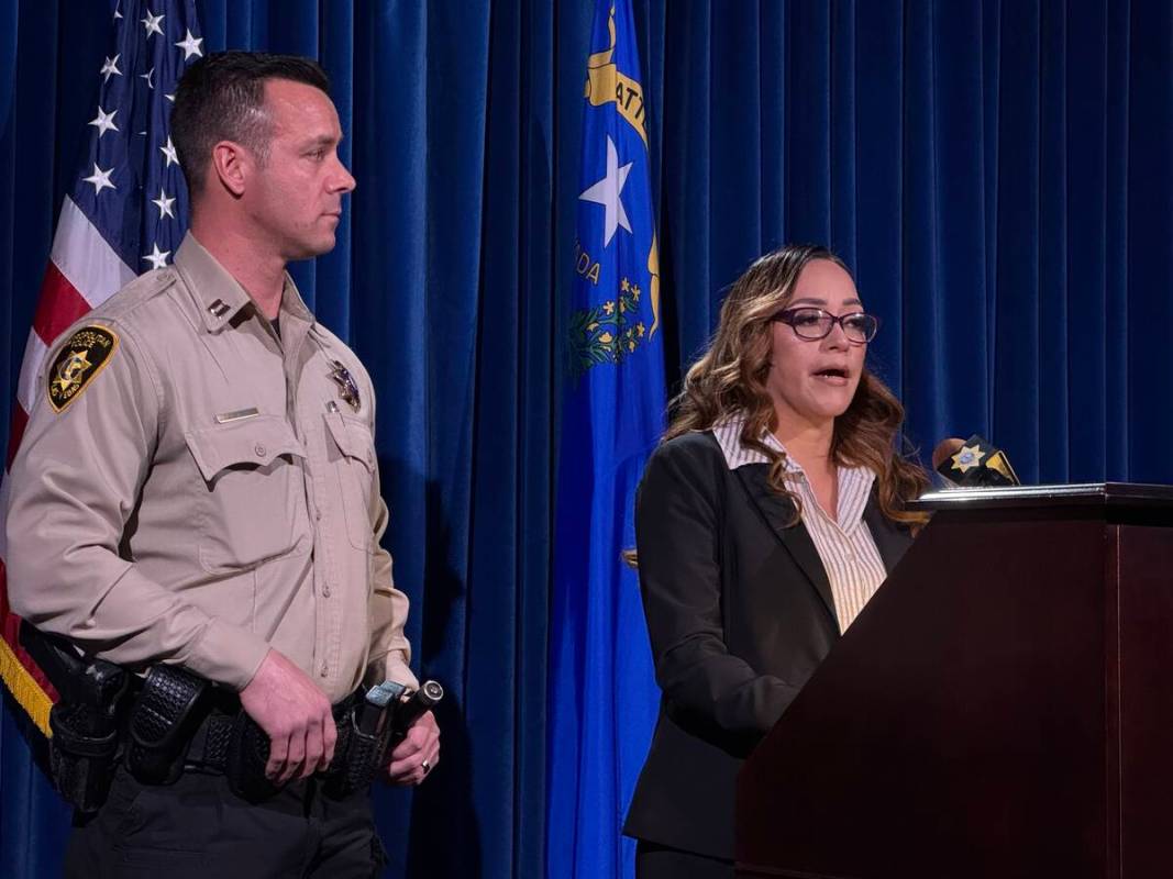 Martha Carbajal, accompanied by Metropolitan Police Department Capt. Jonathan Riddle, speaks to ...