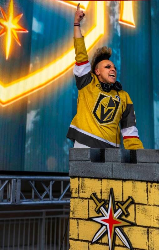 DJ Michael Toast pumps up the crowd outside before game five of the Golden Knights against the ...
