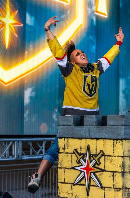 DJ Michael Toast pumps up the crowd outside before game five of the Golden Knights against the ...