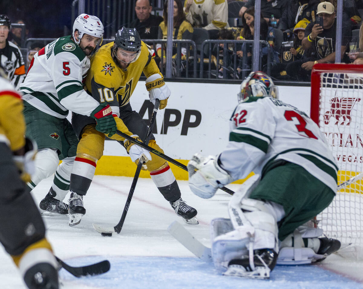 Golden Knights center Nicolas Roy (10) looks to shoot against Minnesota Wild goaltender Filip G ...