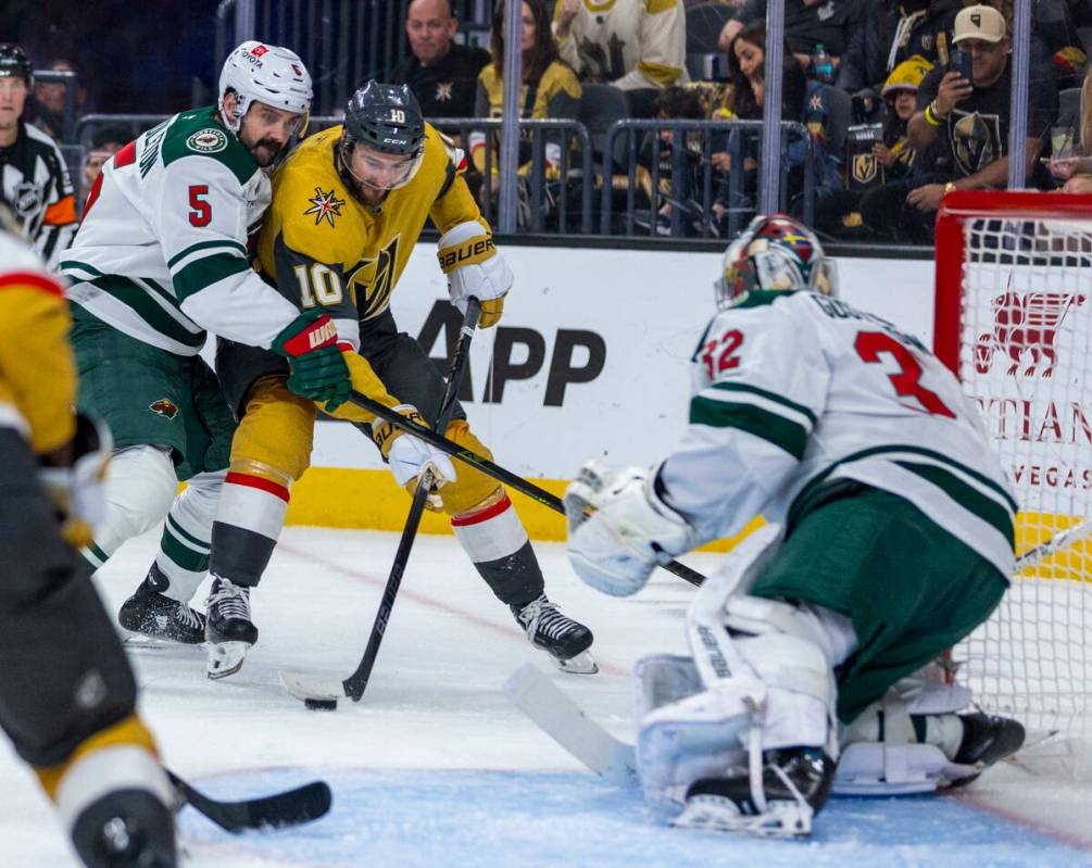 Golden Knights center Nicolas Roy (10) looks to shoot against Minnesota Wild goaltender Filip G ...