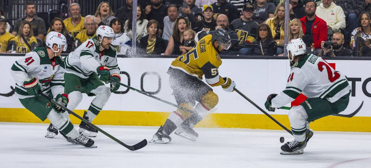 Golden Knights right wing Keegan Kolesar (55) looks to advance the puck past Minnesota Wild def ...