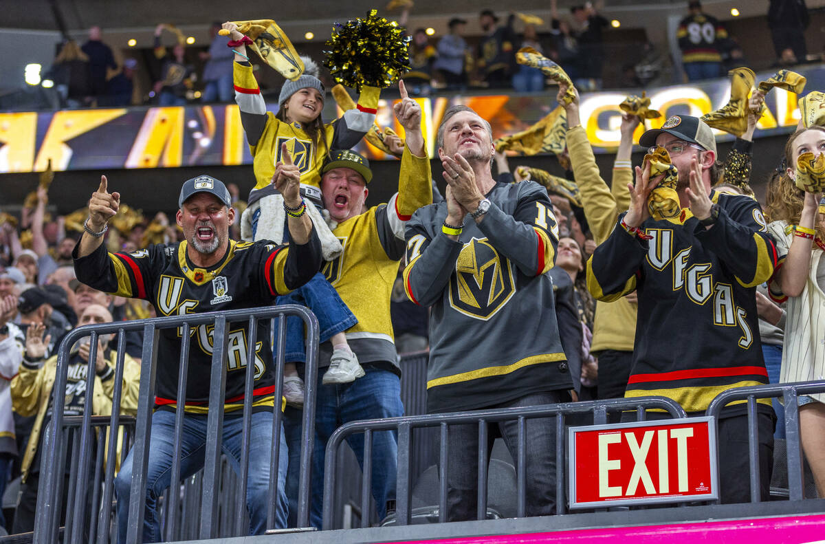 Golden Knights fans celebrate their first goal against the Minnesota Wild during the first peri ...