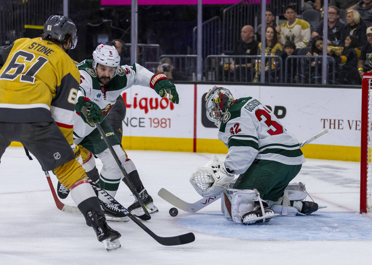 Golden Knights right wing Mark Stone (61) attempts to score against Minnesota Wild goaltender F ...