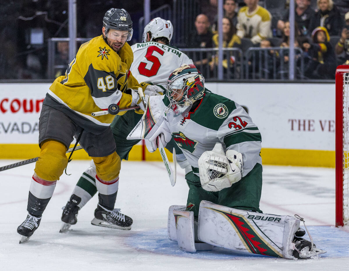Golden Knights center Tomas Hertl (48) looks to deflect a puck off his stick and into the net a ...