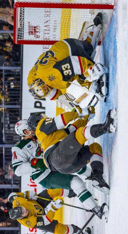 Golden Knights goaltender Adin Hill (33) stops a shot from Minnesota Wild center Joel Eriksson ...