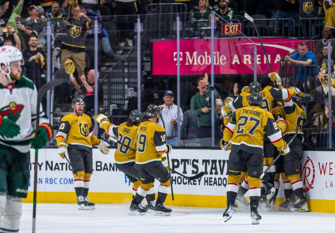 Golden Knights players celebrate their goal and win against the Minnesota Wild during the overt ...