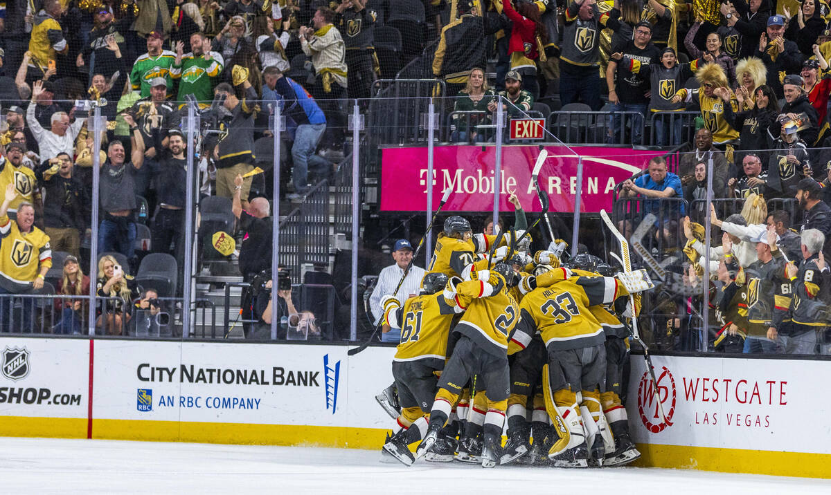 Golden Knights players celebrate their goal and win against the Minnesota Wild during the overt ...
