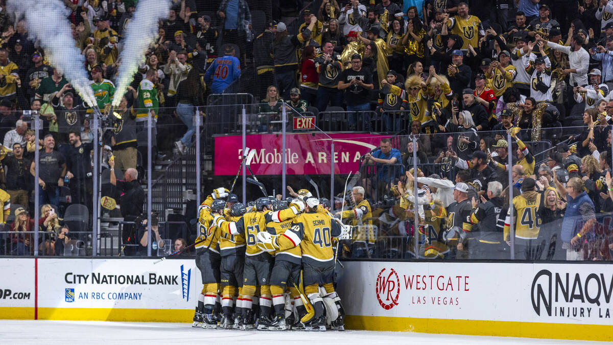 Golden Knights players celebrate their goal and win against the Minnesota Wild during the overt ...