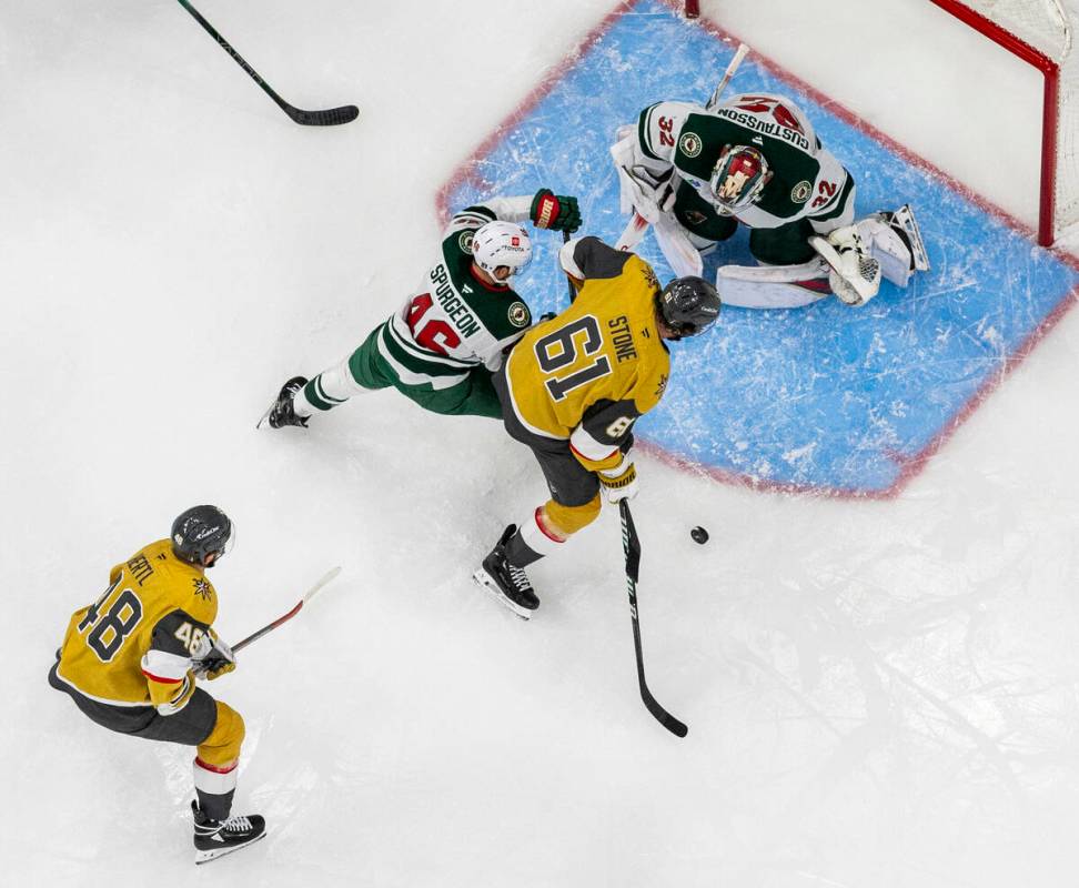 Golden Knights right wing Mark Stone (61) eyes the net against Minnesota Wild goaltender Filip ...