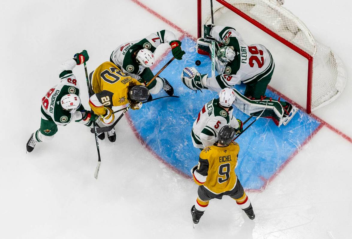 Minnesota Wild goaltender Marc-Andre Fleury (29) defends the net from Golden Knights left wing ...