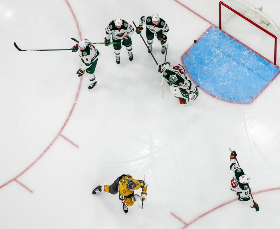 Golden Knights center Brett Howden (21) scores on Minnesota Wild goaltender Marc-Andre Fleury ( ...