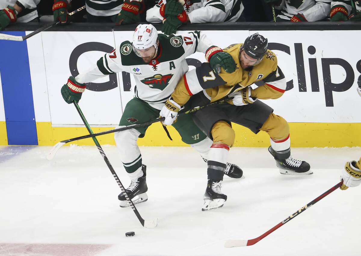 Minnesota Wild left wing Marcus Foligno (17) and Golden Knights defenseman Alex Pietrangelo (7) ...
