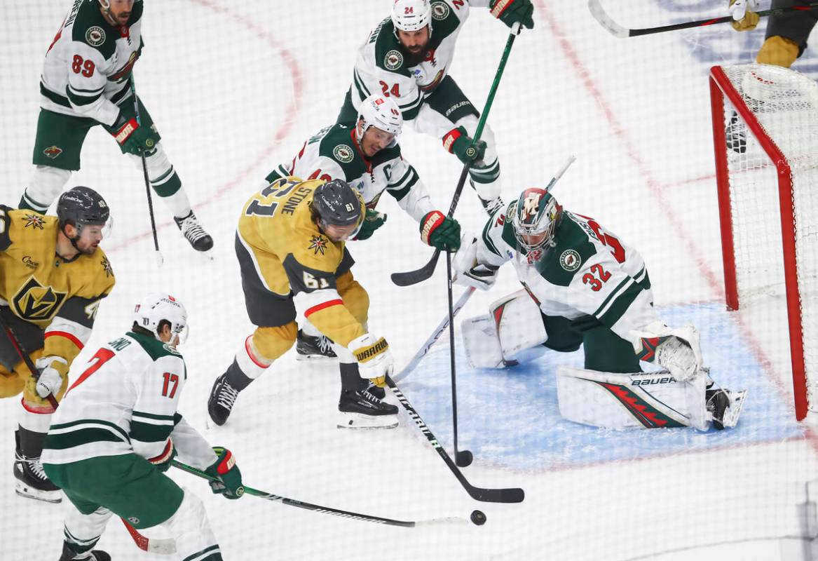 Minnesota Wild goaltender Filip Gustavsson (32) and defenseman Jared Spurgeon (46) defend as Go ...