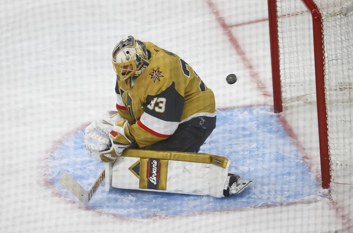 A shot from Minnesota Wild left wing Matt Boldy, out of frame, gets past Golden Knights goalten ...
