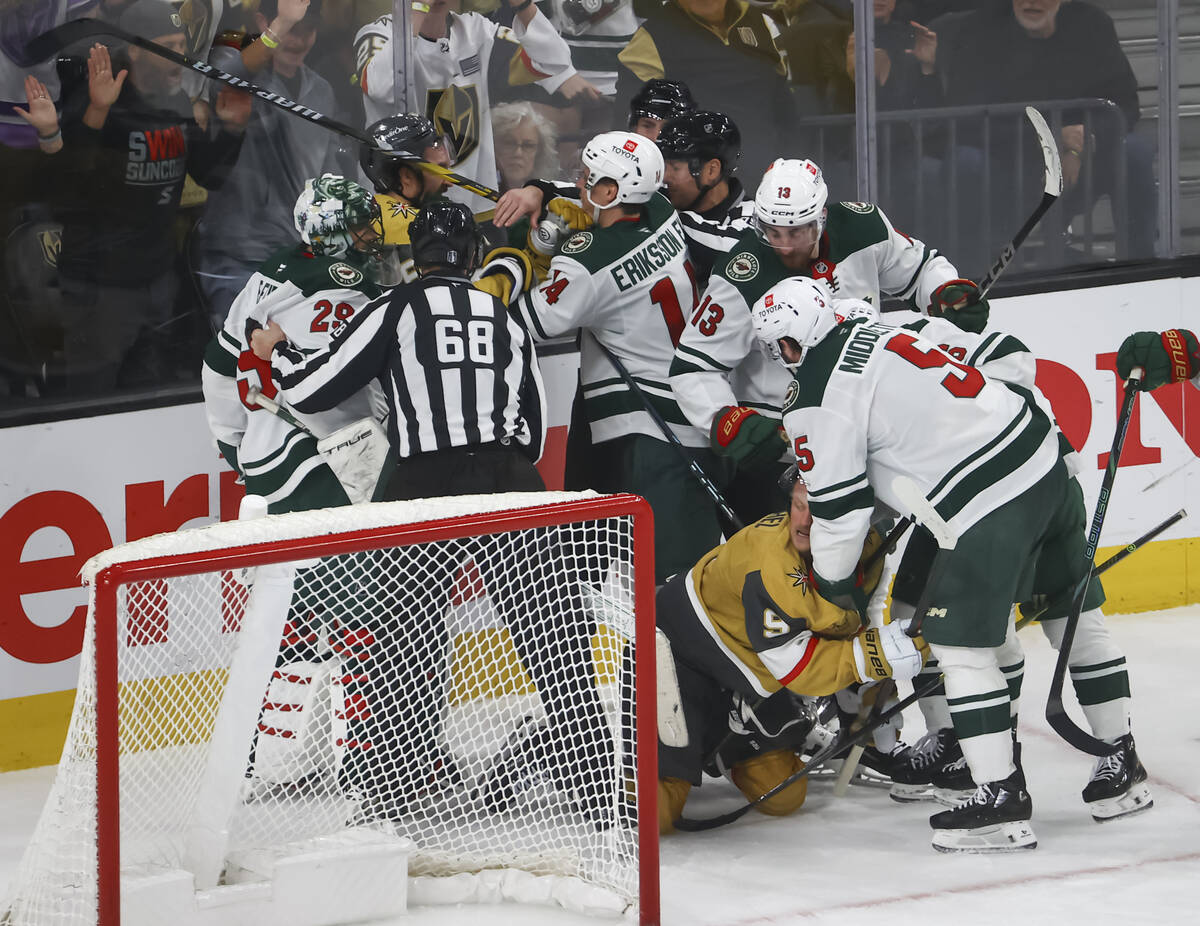 Golden Knights players get into a fight with the Minnesota Wild during the third period of Game ...