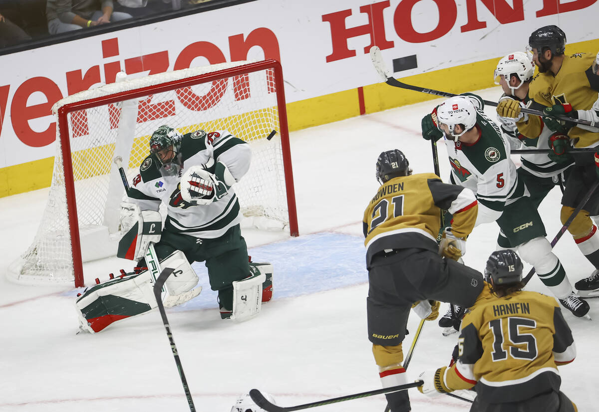 Minnesota Wild goaltender Marc-Andre Fleury (29) deflects a shot from the Golden Knights during ...