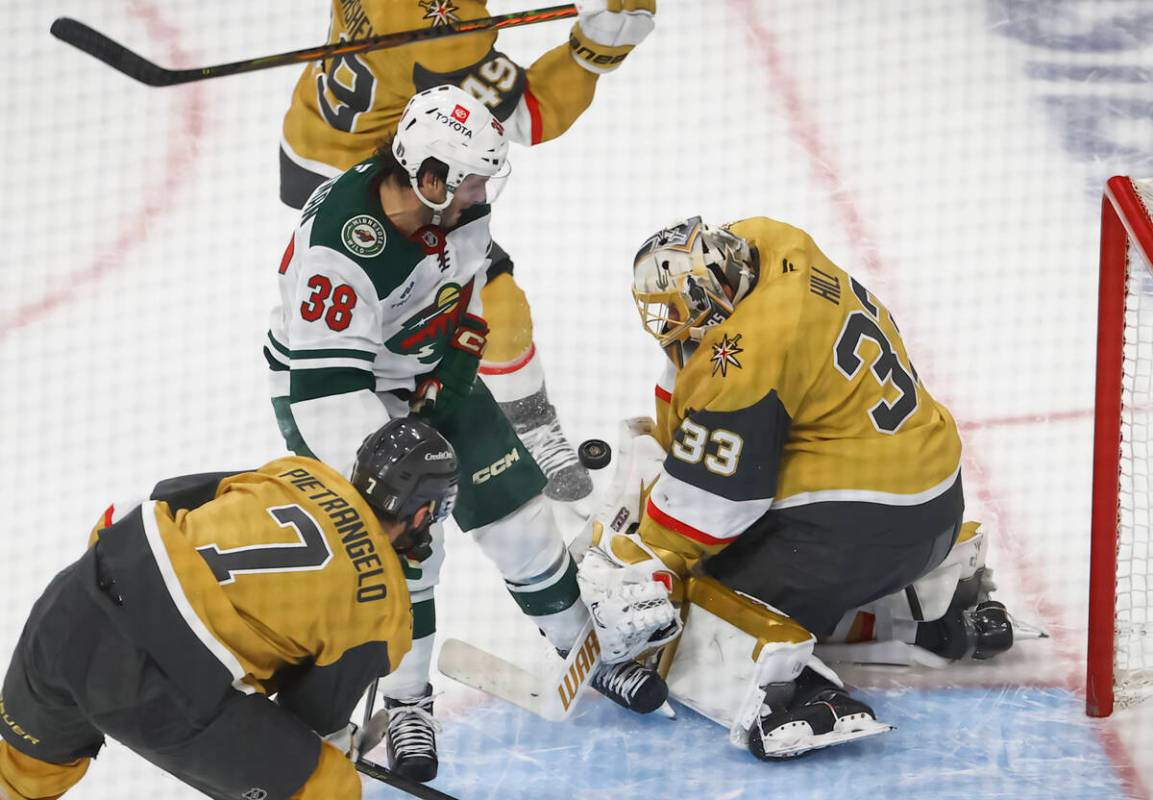 Minnesota Wild right wing Ryan Hartman (38) knocks the puck into the net with his knee past Gol ...
