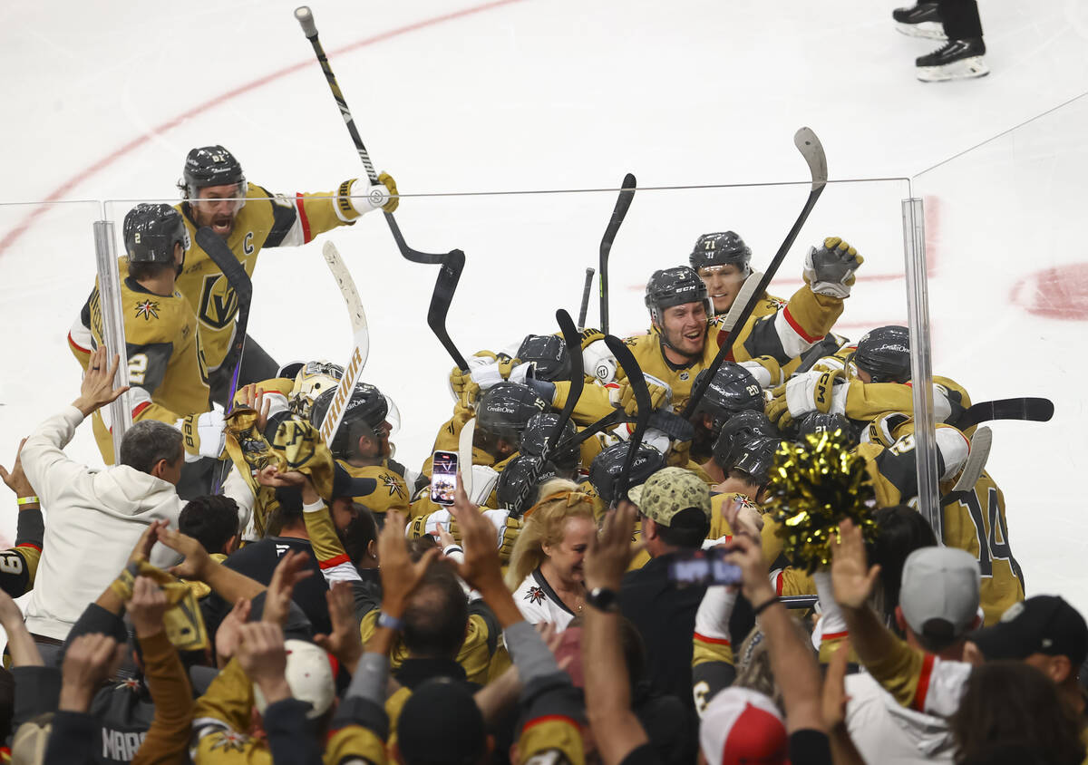 The Golden Knights celebrate their overtime win against the Minnesota Wild in Game 5 of an NHL ...