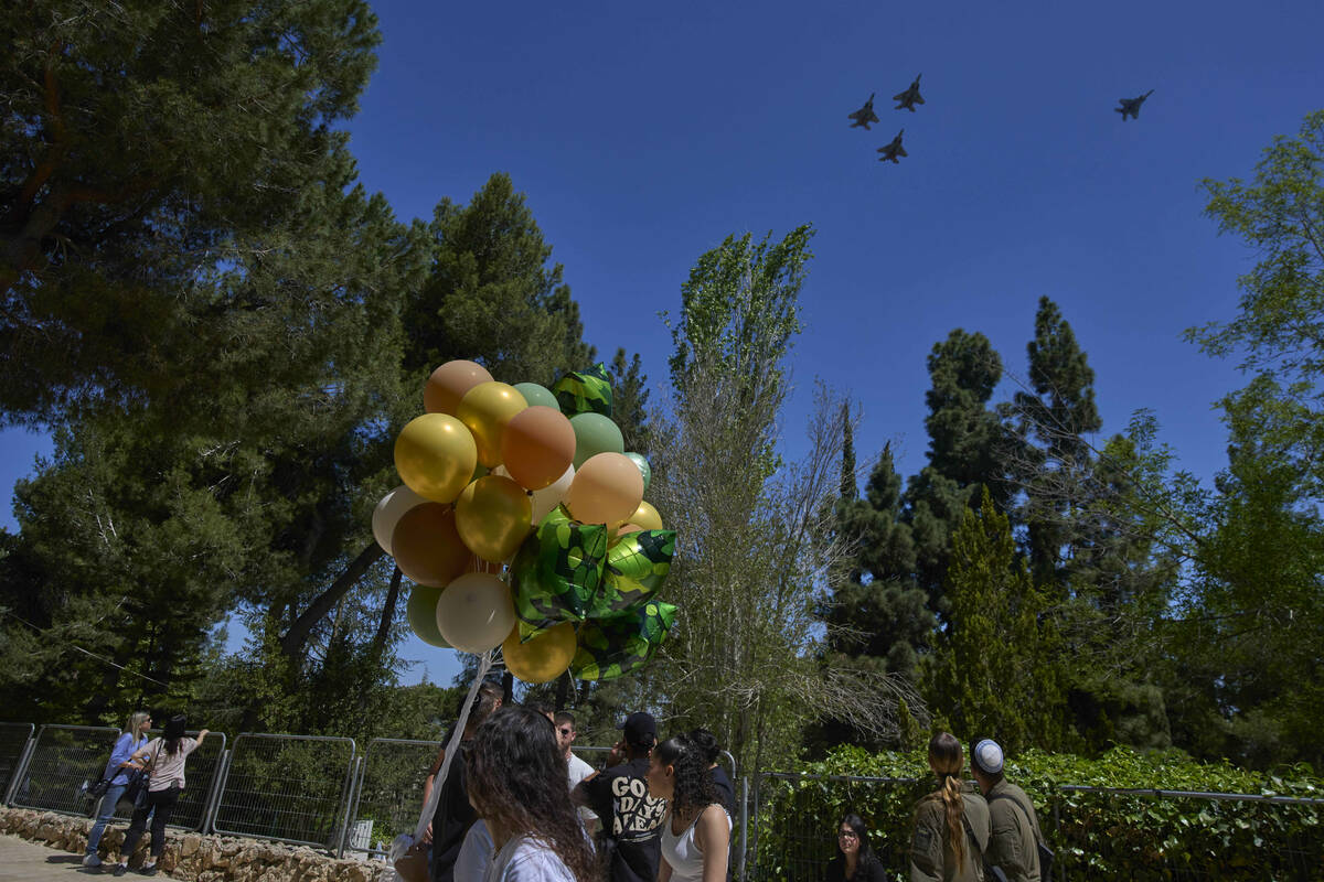 Israeli fighter jets fly over Mount Herzl military cemetery in Jerusalem, Tuesday, April 29, 20 ...