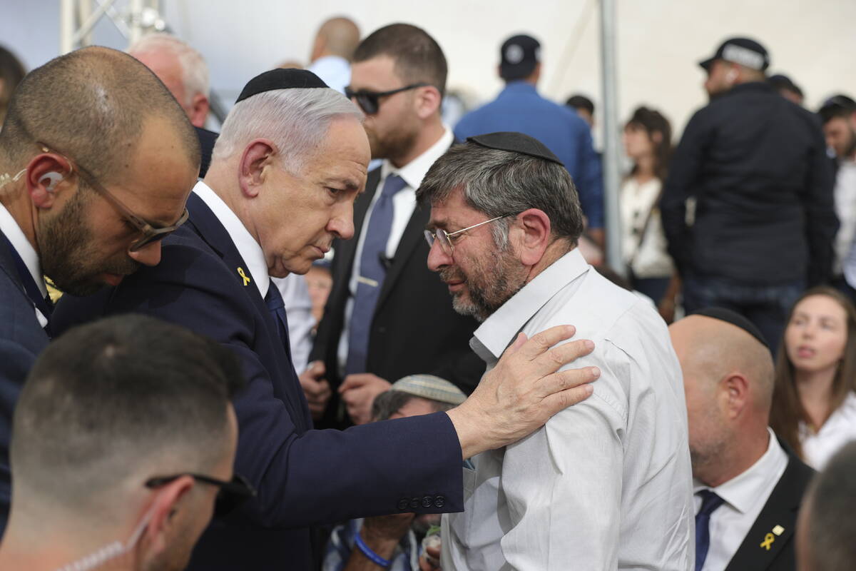 Israeli Prime Minister Benjamin Netanyahu talks with Meir Hershkowitz the father of fallen Isra ...