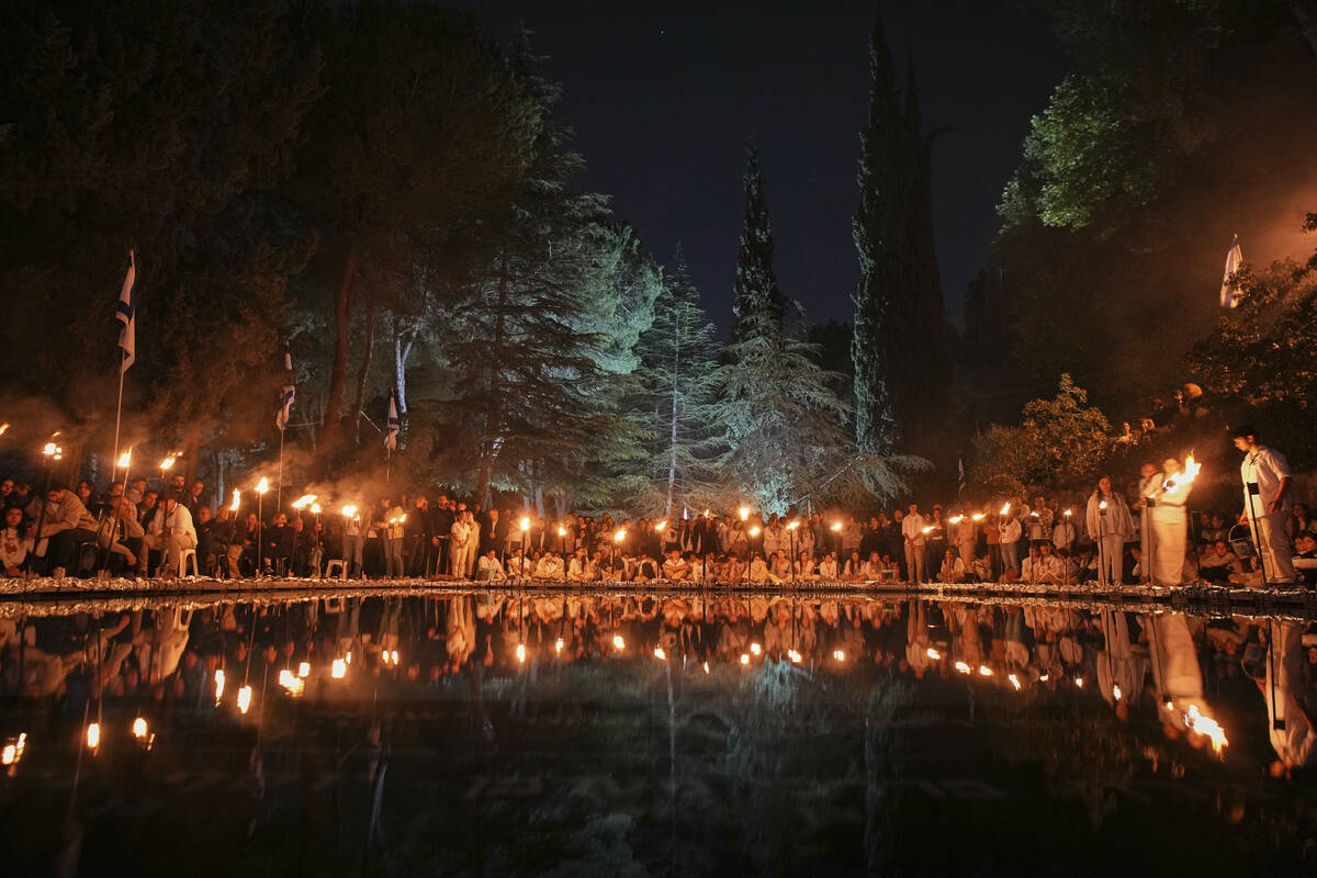 Israeli scouts light torches marking the annual Memorial Day for the fallen soldiers, at Mount ...